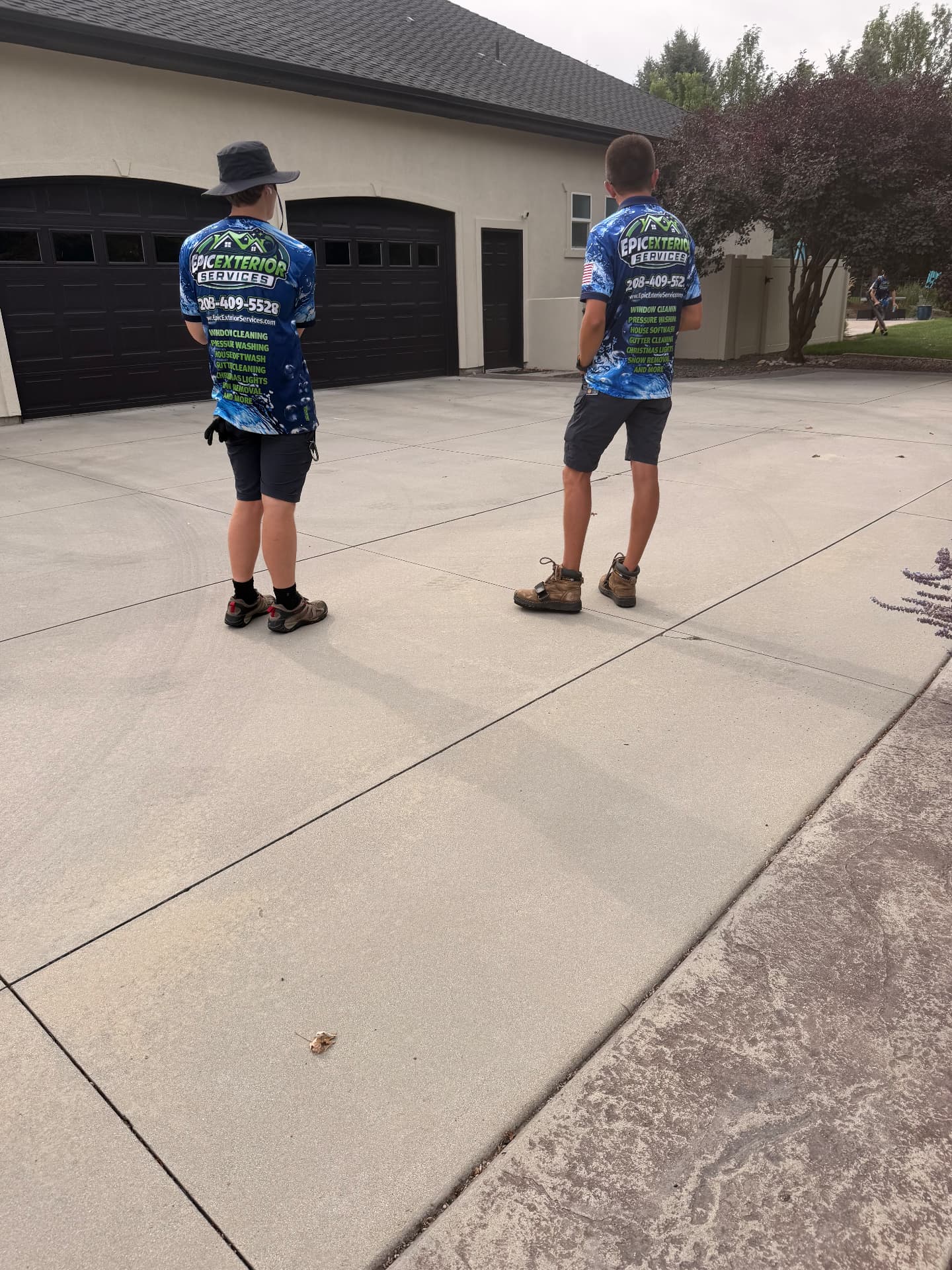 Epic Exterior Services crew on a freshly pressure washed Boise driveway