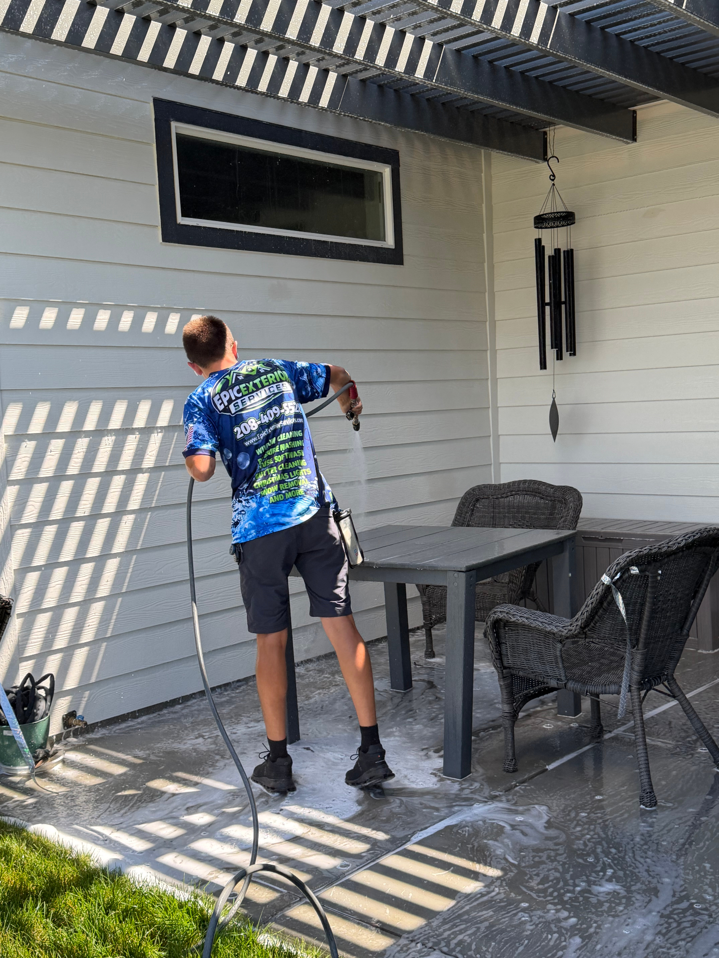 Epic Exterior Services soft washing a home exterior in the Treasure Valley