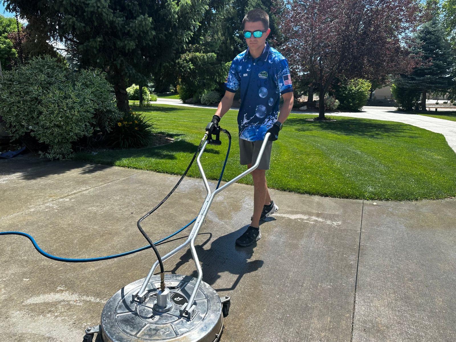 Pressure washing concrete driveway in Boise